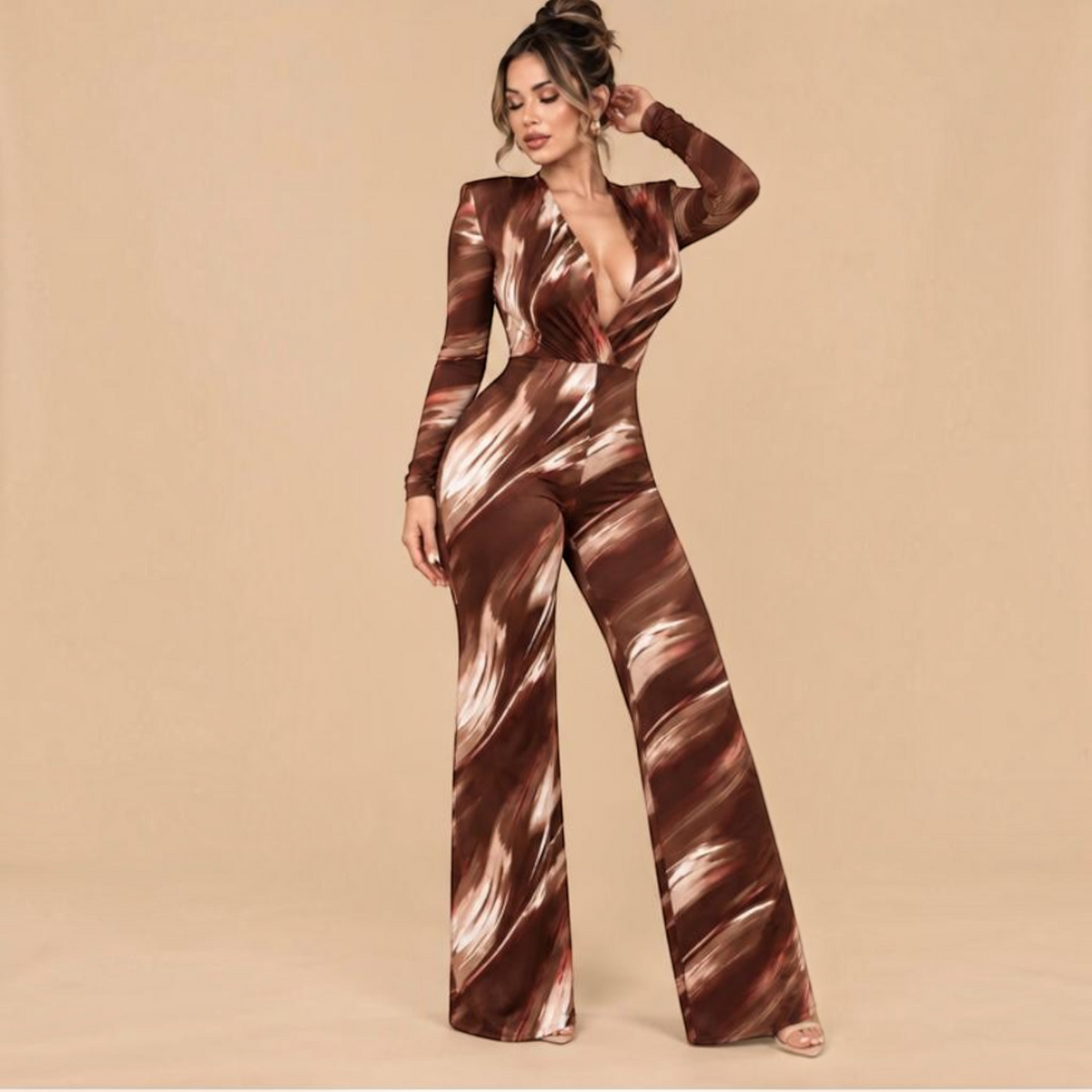 Angie Style Boutique slim fit long sleeve jumpsuit in brown with a white abstract print, V-neck, and shoulder pads.