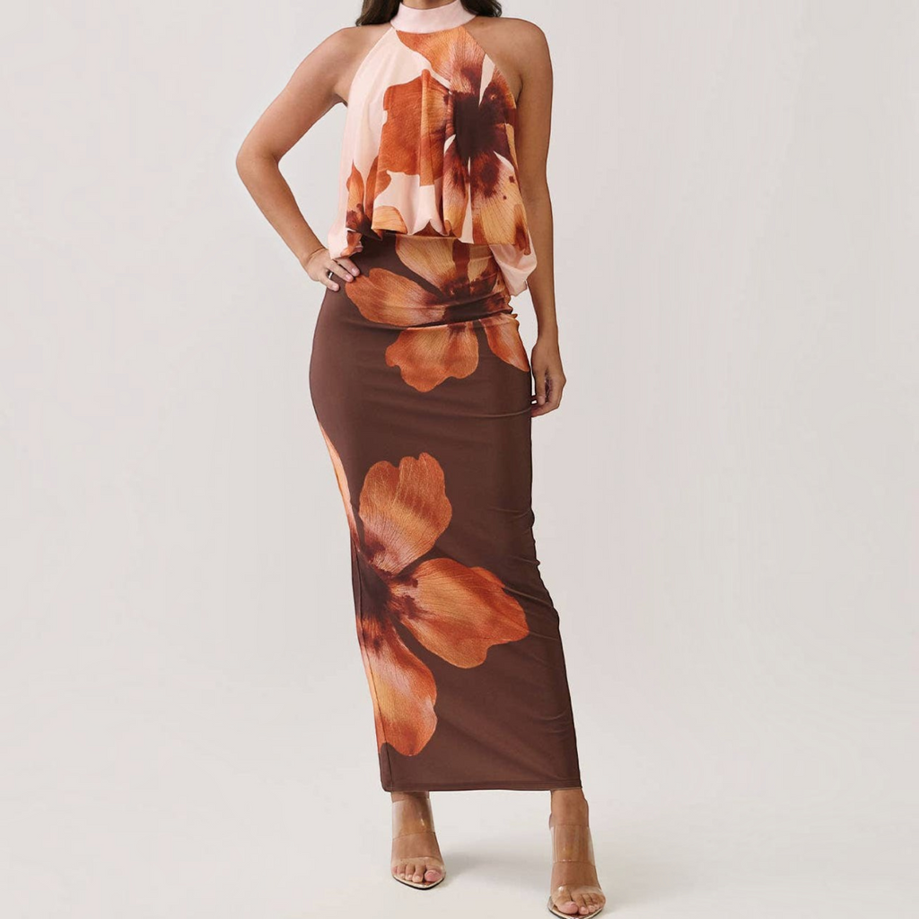 Angie Style Boutique floral print maxi dress with a draped halter bodice, open back, and bodycon silhouette.