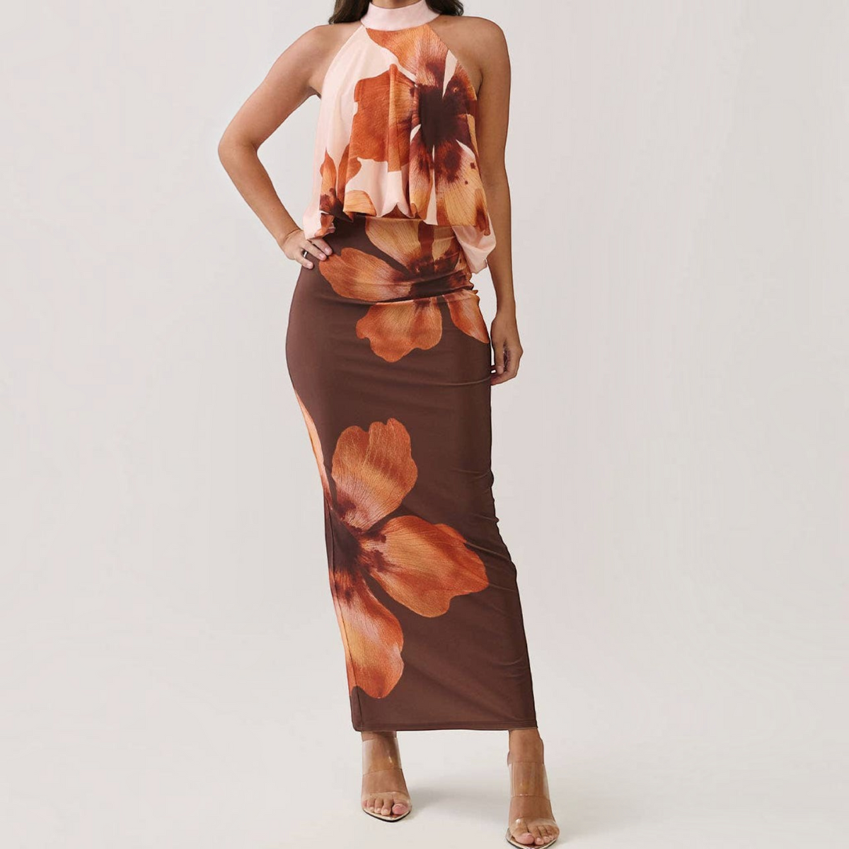 Angie Style Boutique floral print maxi dress with a draped halter bodice, open back, and bodycon silhouette.