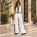 Angie Style Boutique white and green wide-leg jumpsuit with a zip-up front, worn by a woman with sunglasses.