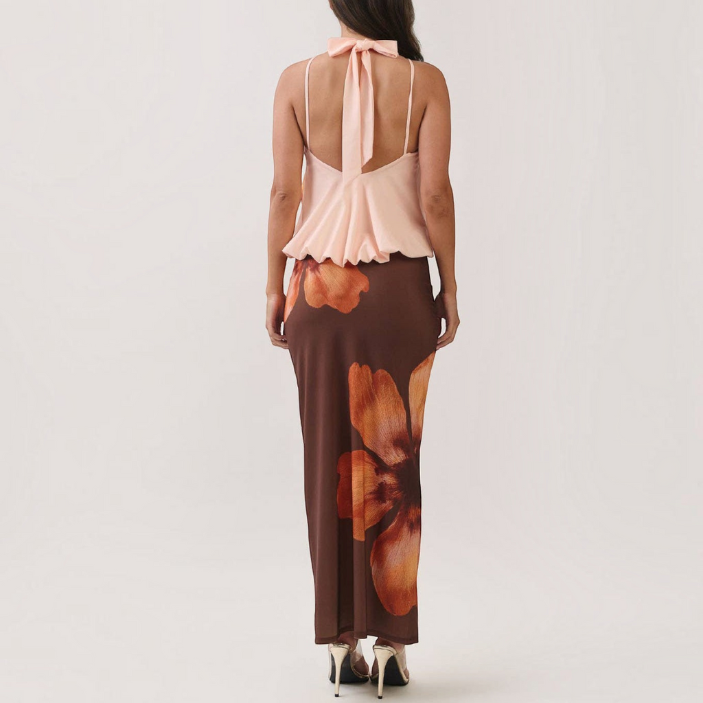 Angie Style Boutique floral print maxi dress with a peach halter top, draped bodice, and open back design.