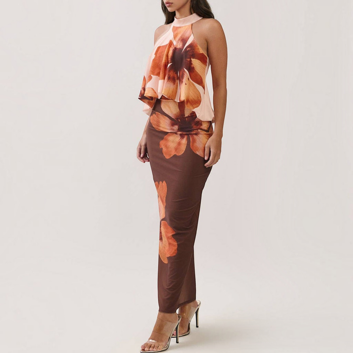 Angie Style Boutique floral print maxi dress with a draped halter bodice, open back, and bodycon silhouette.