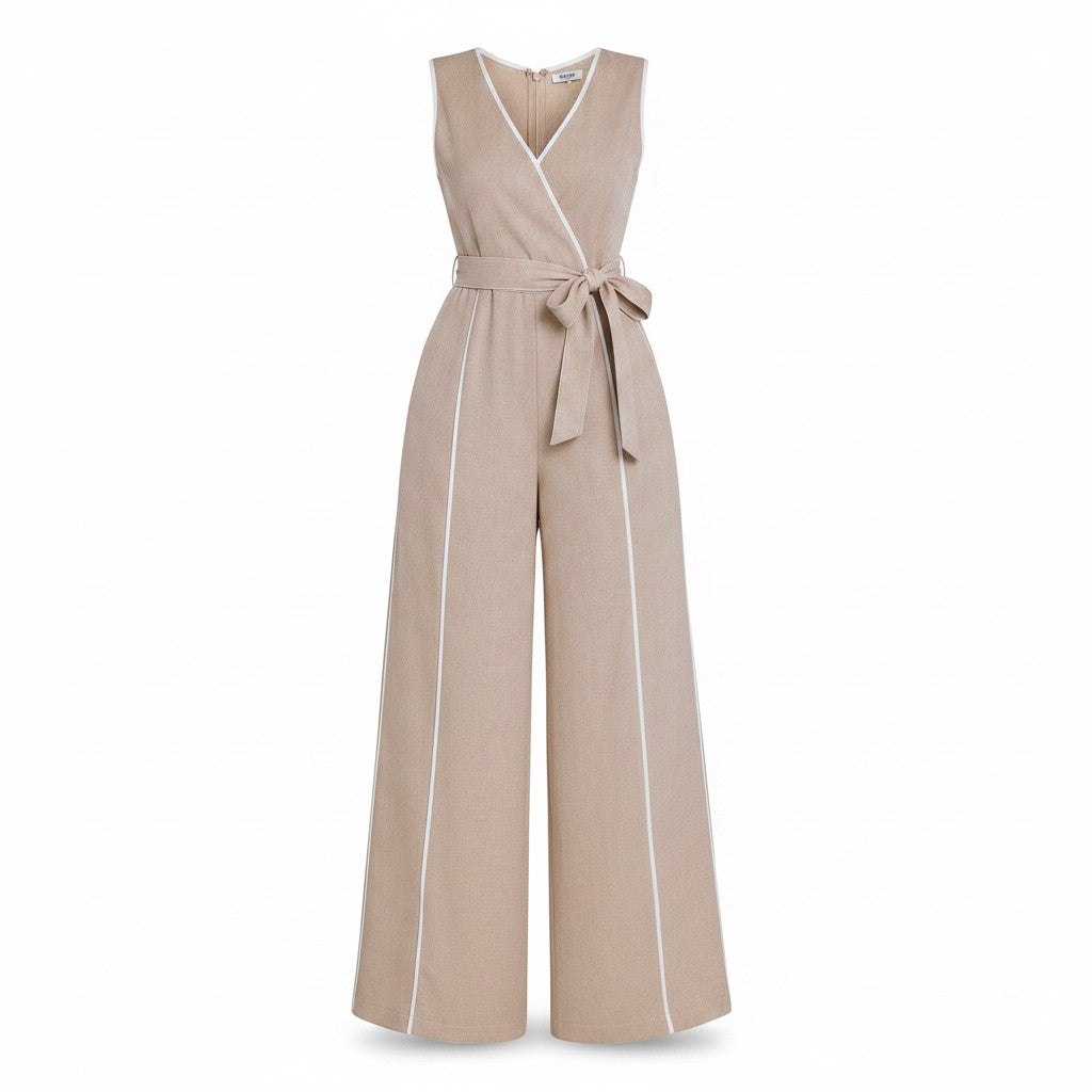 Angie Style Boutique beige sleeveless wide-leg jumpsuit with V-neck, waist tie, and white contrast piping details.