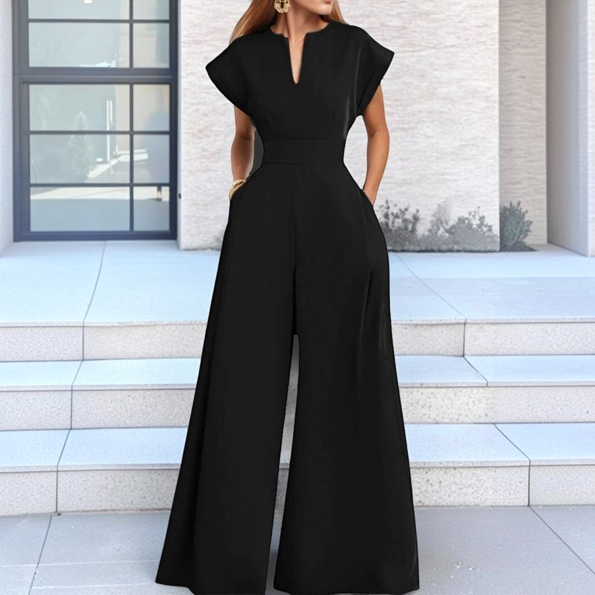 Angie Style Boutique black high-waist wide-leg jumpsuit with a V-neckline and short sleeves on a model
