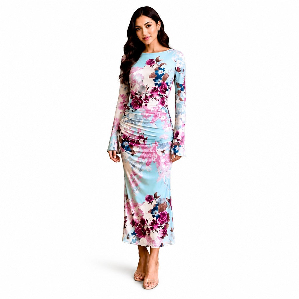 Angie Style Boutique floral long sleeve maxi dress with ruched detailing on a model, featuring pastel blue tones.