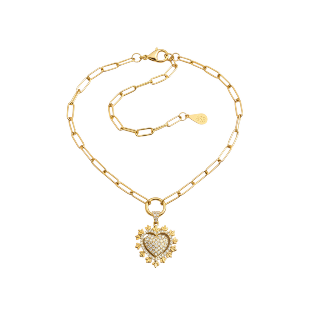 Angie Style Boutique gold chunky link chain necklace featuring a pavé cubic zirconia heart pendant charm.
