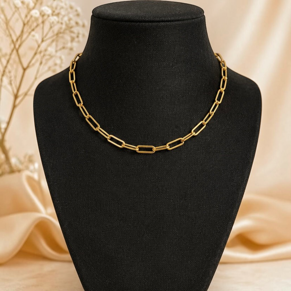 Angie Style Boutique gold paperclip chain necklace with polished elongated oval links on a black display bust