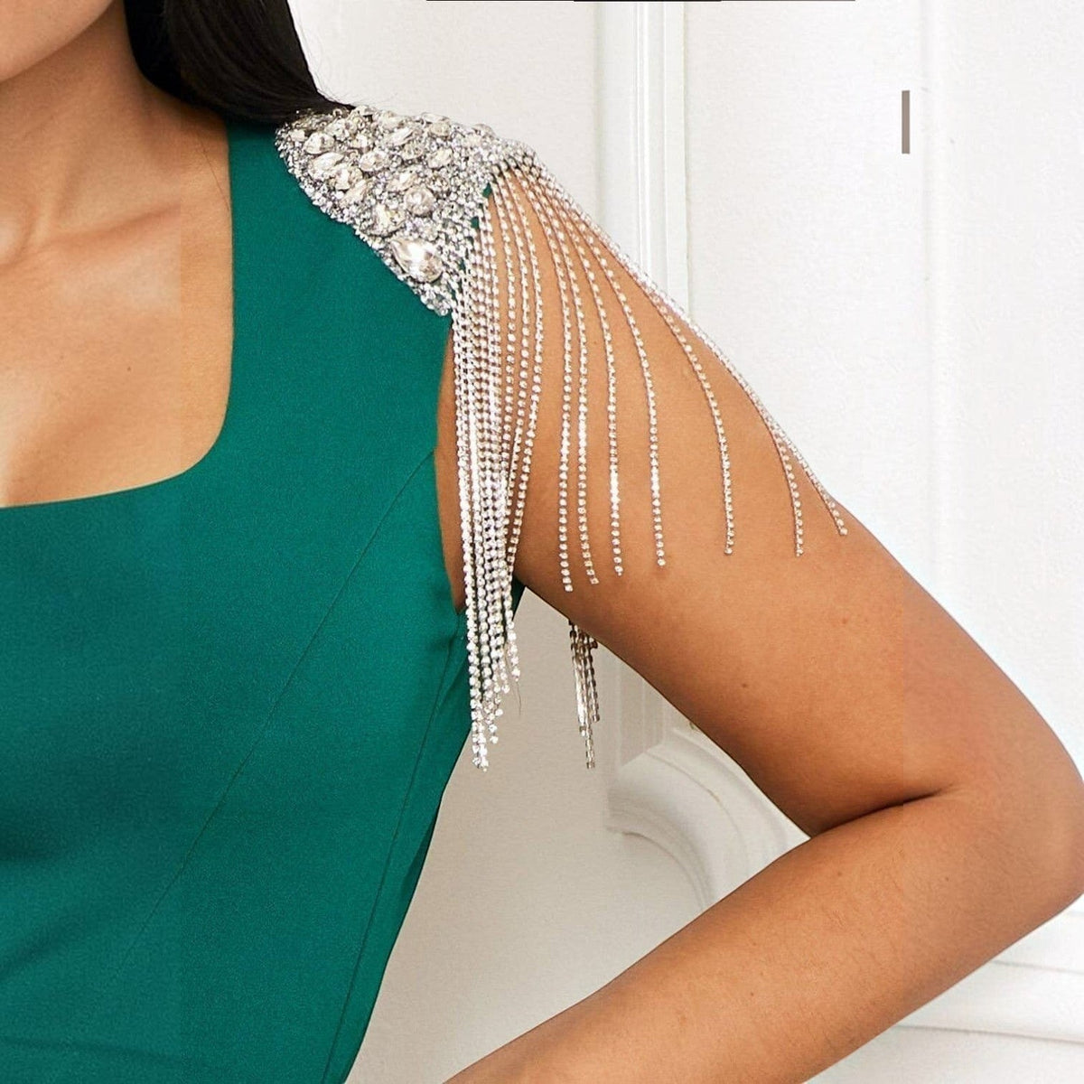 Angie Style Boutique green sleeveless jumpsuit featuring silver rhinestone fringe detail on the shoulder