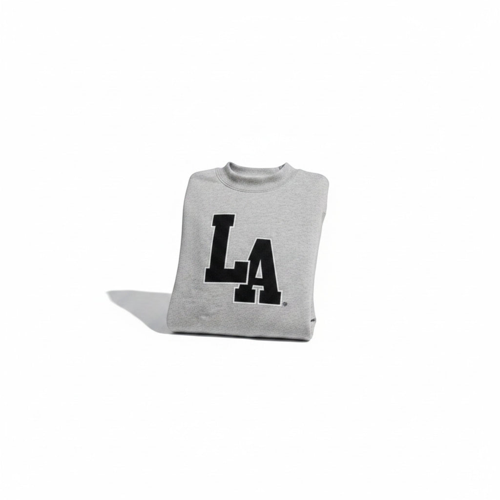 Angie Style Boutique grey oversized crewneck sweatshirt with bold black LA graphic in soft fleece fabric