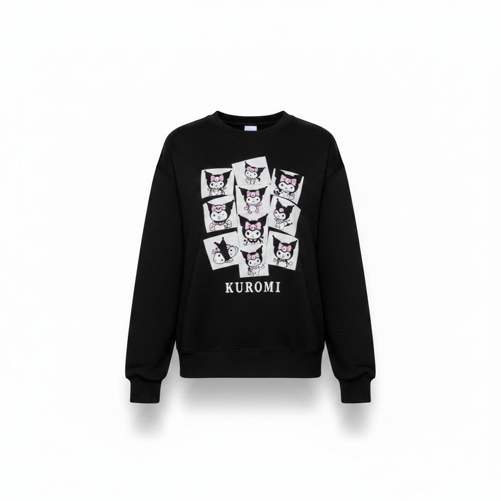 Angie Style Boutique black crewneck sweatshirt featuring a multi-panel Kuromi graphic print on the front.