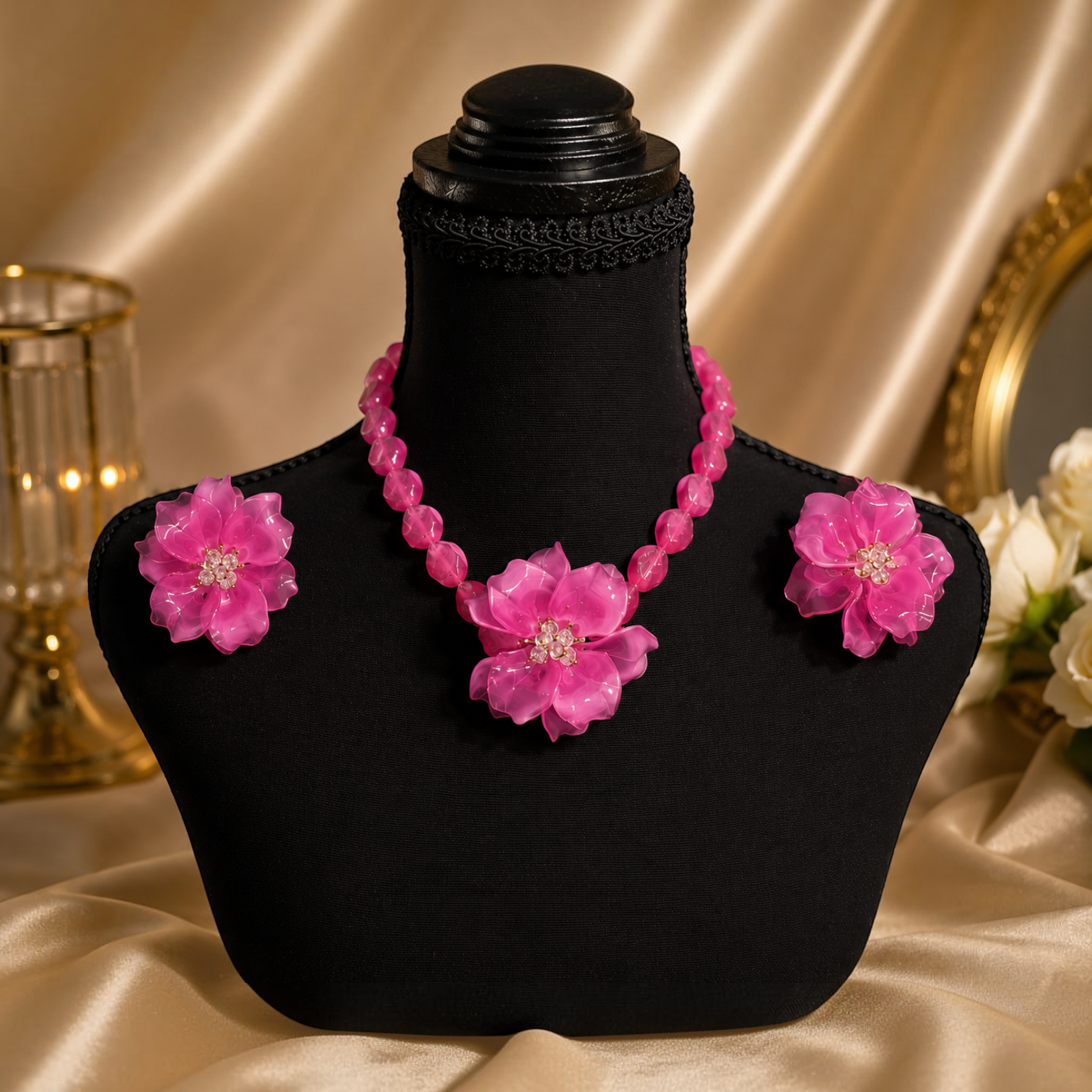 Angie Style Boutique hot pink floral beaded statement necklace and matching earring set on a black display bust.