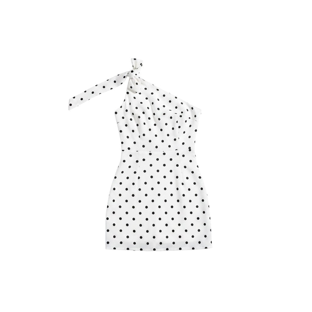 Angie Style Boutique white mini dress with black polka dots, featuring an asymmetrical one-shoulder tie strap design.