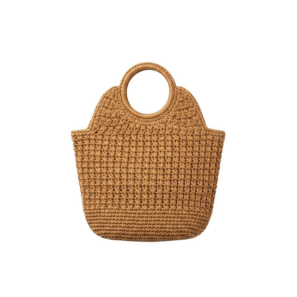 Angie Style Boutique woven straw tote bag in tan with structured circular top handles for a bohemian summer look.