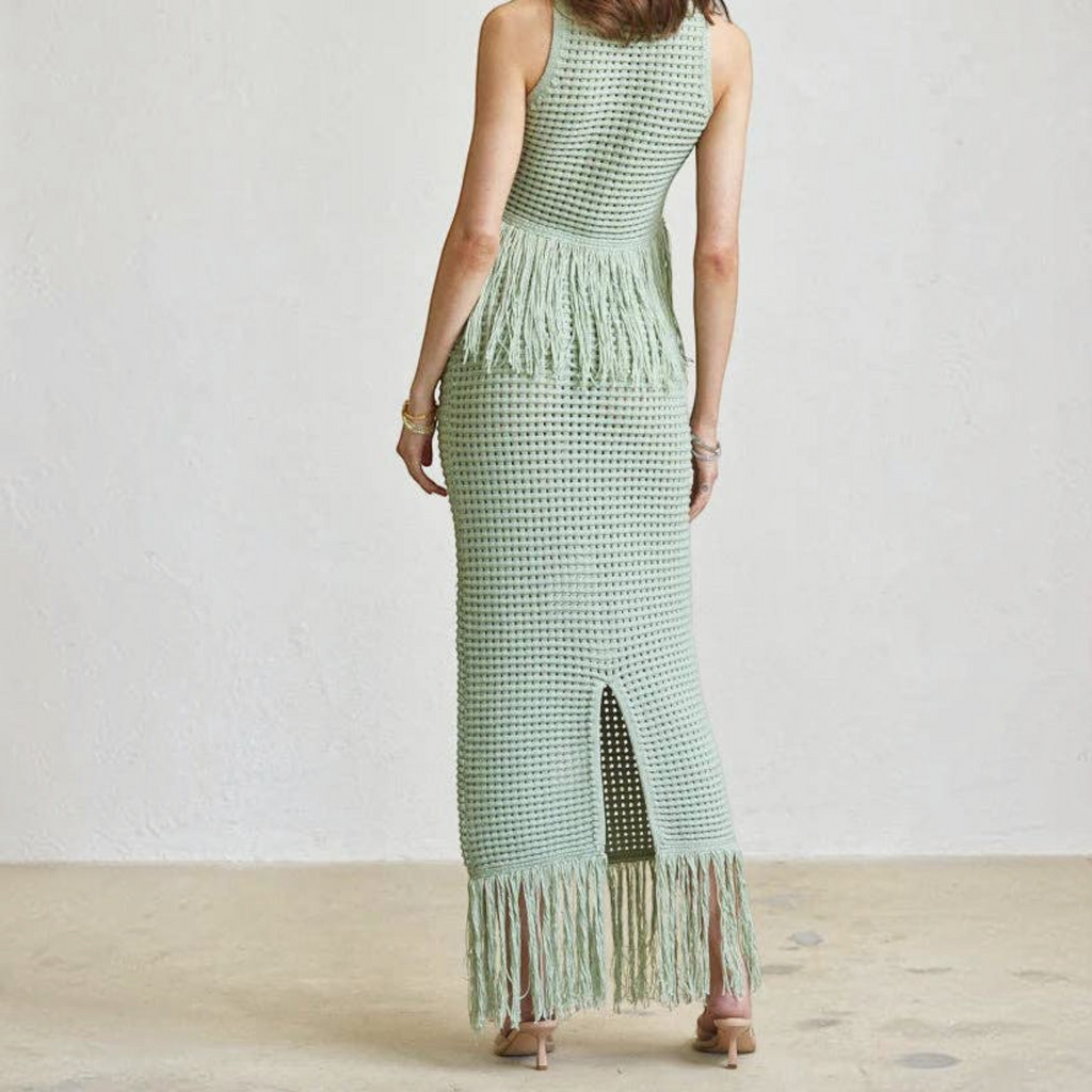Back view of Angie Style Boutique sage green crochet maxi skirt set with fringe hem and sleeveless crop top