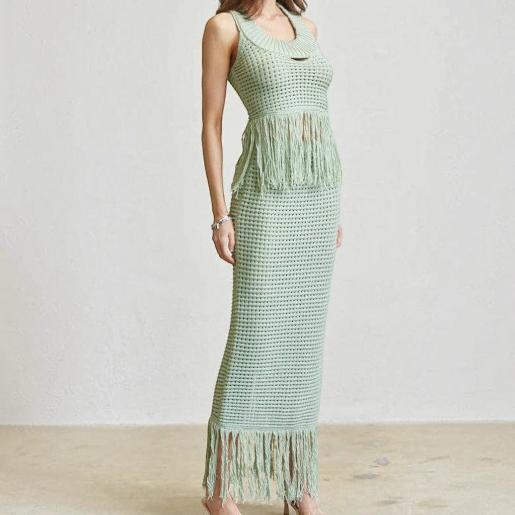 Angie Style Boutique sage green crochet knit crop top and maxi skirt set with fringe detailing on a model
