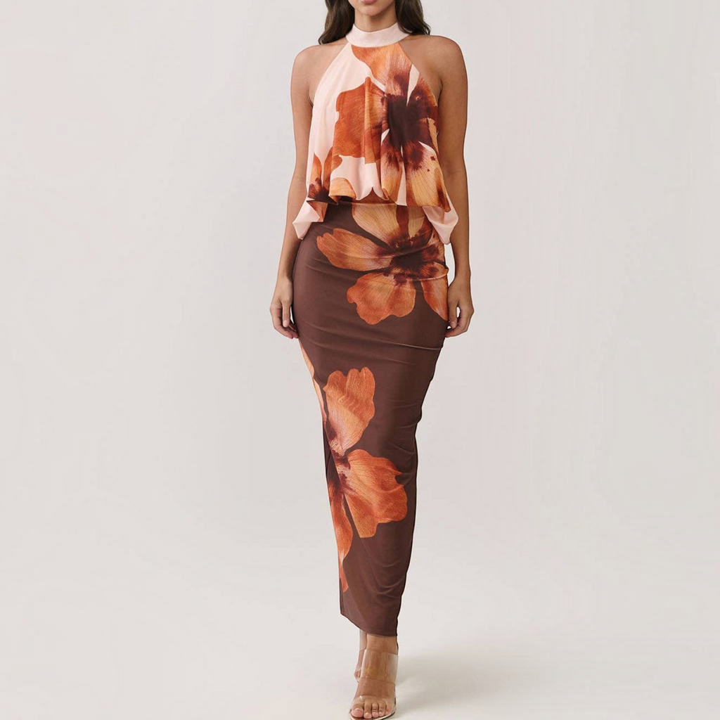 Angie Style Boutique floral print maxi dress with a draped halter bodice, open back, and bodycon silhouette.