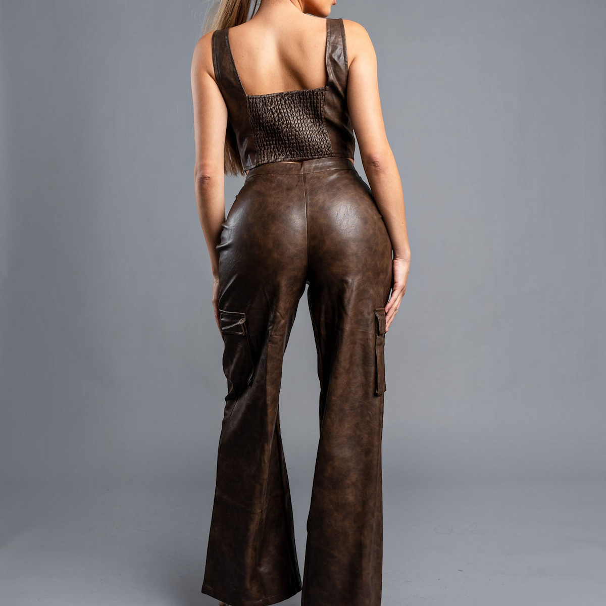 Angie Style Boutique brown tie dye faux leather bustier top and matching cargo pants set on a model, back view